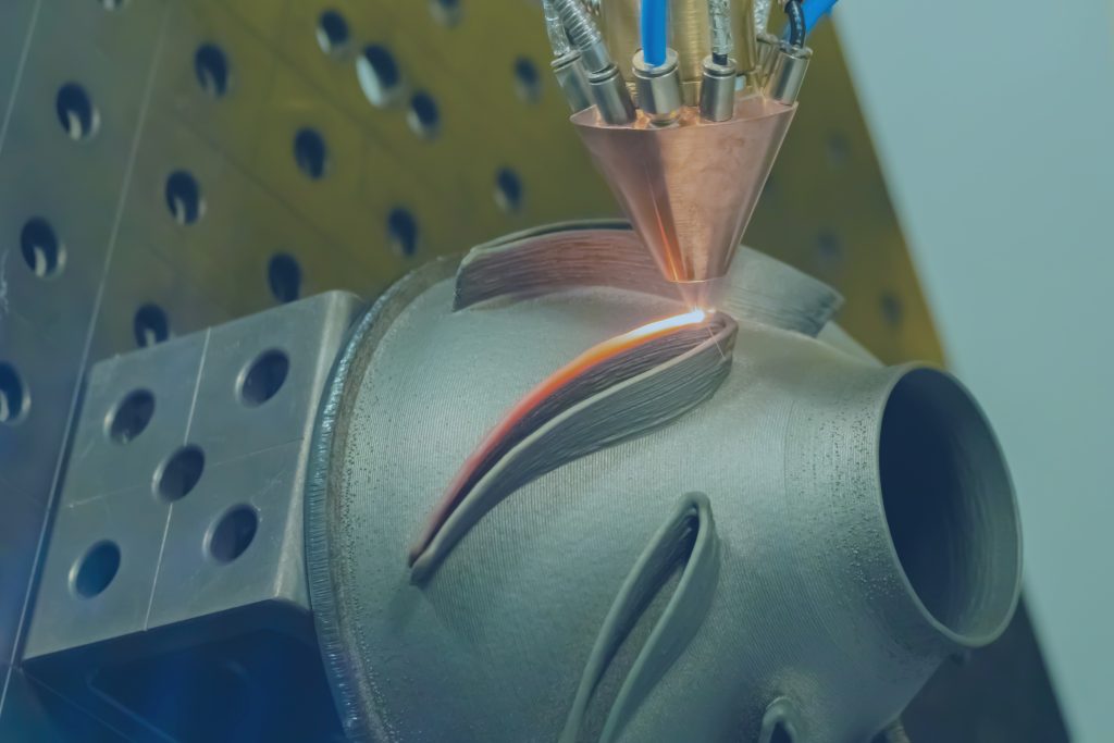 Laser Direct Energy Deposition (DED) head building a metal part layer by layer, as part of the MultiscaleDED project